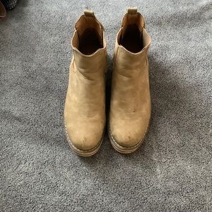 Brown boot have been worn and need a little wash